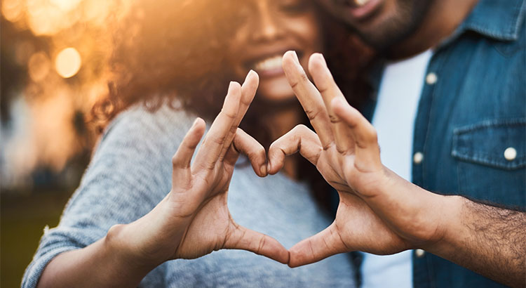 couple with heart hands