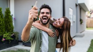 A couple celebrating their home purchase.